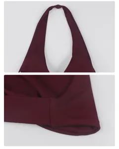 Detailed close-up view of a maroon halter sports bra showing neckline and fabric texture.