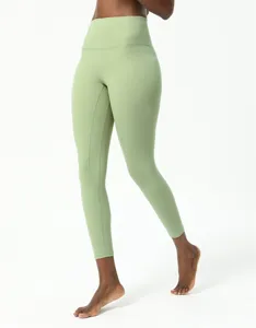 Detailed view of high-waisted green yoga leggings, featuring a flattering fit and ankle length.