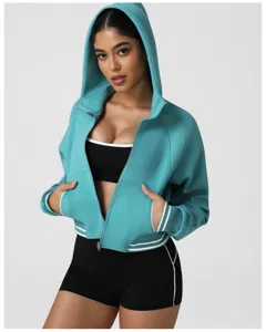 Turquoise zip-up hoodie with contrasting white stripes, detail view of athletic wear.