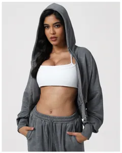 Detailed view of women activewear set grey zip hoodie white sports bra casual fitness.