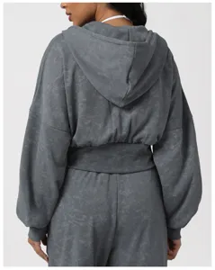 Dark grey vintage wash cropped hoodie detail, back view of activewear set, long sleeve top.