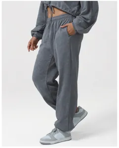 Detail view of grey tie-dye cropped hoodie and matching high-waisted casual sweatpants.
