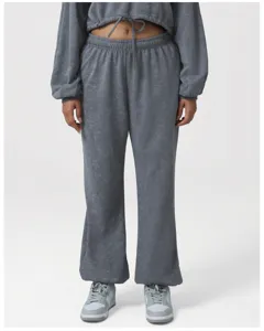 Detailed view of grey acid wash casual sweatpants and crop top with high waist drawstring.