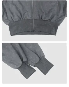 Close up view of the grey vintage washed zip up hoodie showing zipper and ribbed cuffs details.