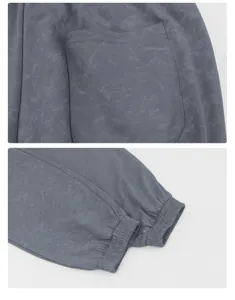 Detailed view of casual sweatpants with elastic cuffed hems and back pocket design.