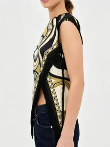 Side view detail showing the irregular retro geometric print top with black fringe trim
