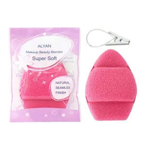 Detail view of pink facial cleansing sponge with its retail packaging and hanging clip
