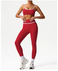 Red seamless athletic activewear set high waist yoga leggings and sports bra for fitness.