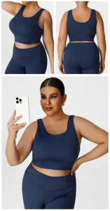 Plus size sports bra and yoga pants set in dark blue, high elasticity for comfortable fitness.