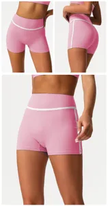 High waist colorblock yoga shorts detail, stretchy pink fitness activewear booty shorts.
