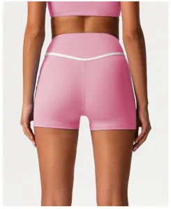 Detail view of high-waisted contrast color athletic yoga shorts, quick-dry fitness wear.