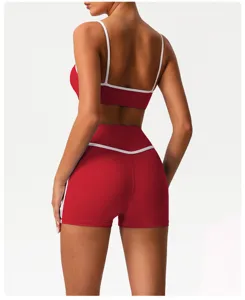 Red backless activewear set with white trim, sports bra and high waist shorts for fitness yoga.