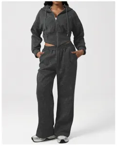 Detail shot of the charcoal mineral wash zip hoodie and matching wide leg sweatpants set.