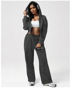 Detailed view of the dark grey mineral-wash zip hoodie and matching sweatpants set.