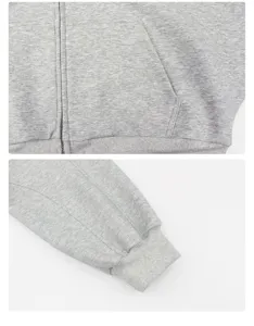 Nahaufnahme eines grauen Kapuzensweatshirts mit Reißverschluss, Tasche und Bündchen.