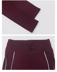 Dettaglio abbigliamento yoga bordeaux donna con maniche a foro pollice e vita a contrasto.