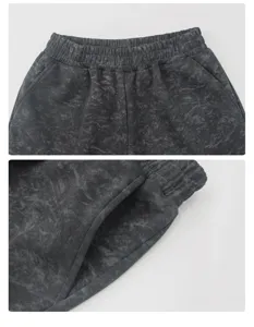 Close-up detail view of the high-waisted acid wash casual sweatpants elastic waistband.