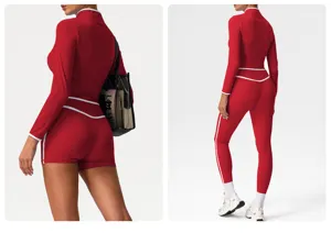 Details of the red athletic crop top and matching leggings set with stylish white piping trim.