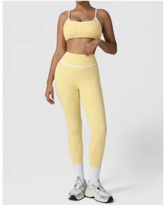 Detailed view of women's yellow high-waist sports yoga leggings and matching athletic bra set.