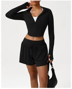 Detail view of black athletic zip jacket and shorts set showcasing soft stretch fabric and fit.