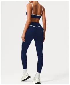 Details of the high-waisted navy blue athletic set featuring a backless sports bra and leggings.