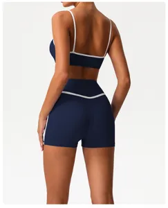 Back view detail of women navy blue athletic crop top and shorts set for gym yoga workout.