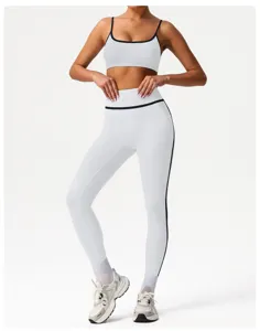 Detailed view of the white high-waisted activewear set showing stylish black trim design.