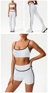 White athletic yoga set detail featuring crop top and high-waisted leggings with contrast piping.