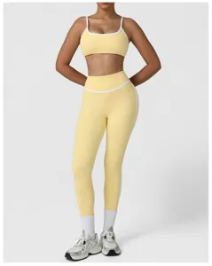 Yellow high waist yoga set sports bra and active fitness leggings with white trim detail.