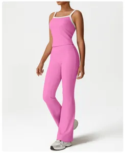 Pink yoga set for women, high-waisted flared pants and contrast strap tank top, activewear.