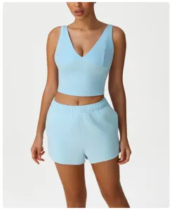 Light blue casual sports workout set, V-neck crop top and matching shorts for fitness.