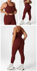 Plus size workout yoga set for women, maroon athletic activewear crop top and leggings outfit.