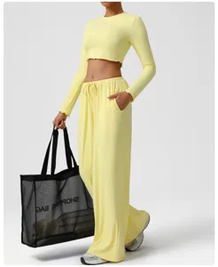 Yellow crop top and wide leg lounge pants detail view, soft breathable fabric for daily wear.
