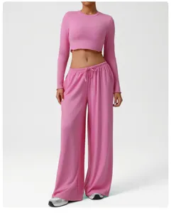 Pink crop long sleeve top and loose lounge pants detail showing soft breathable fabric texture.