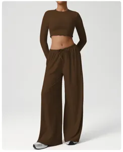 Detailed view of the comfortable brown long-sleeve crop top and wide-leg yoga pants set.