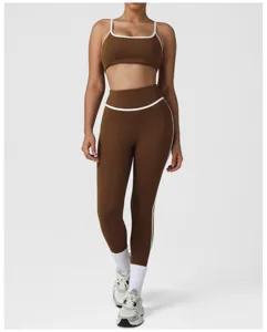 Detail shot of brown two-piece yoga set, high waist sports leggings and matching crop top.