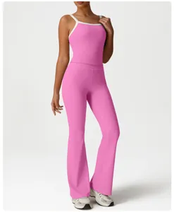 Pink activewear set featuring a contrast trim cami top and slim flare yoga pants.