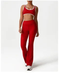Red high-waist flared yoga pants and contrast color sports bra set for active workout fitness.