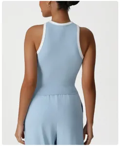 Detail view of women's sports tank top, blue athletic top with white trim for fitness.