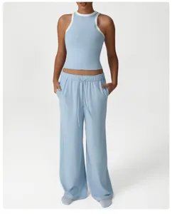Detailed view of the light blue athletic tank top and matching wide leg pants for workout.