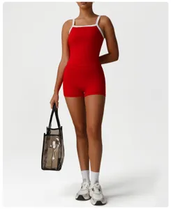 Red sports bra and shorts activewear set detail featuring stylish contrast white straps.