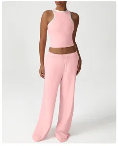 Pink ribbed crop top with contrast white trim and matching pink casual sweatpants set.