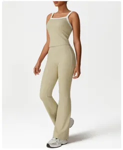 Women's high waist flared yoga pants and contrasting strap tank top set for fitness and workouts.
