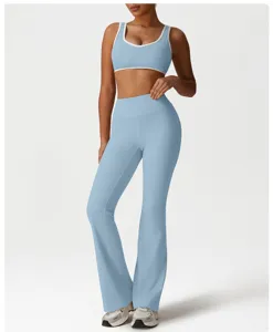 Light blue athletic yoga set detail featuring contrast trim bra and flared pants.