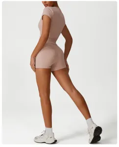 Detailed view of women's sports fitness running shorts and top set in casual nude color style.