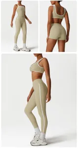 Women activewear yoga set featuring a contrast trim sports bra and high-waist slimming pants.