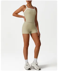 Women athletic yoga two-piece set crop top and tight shorts activewear gym fitness outfit.