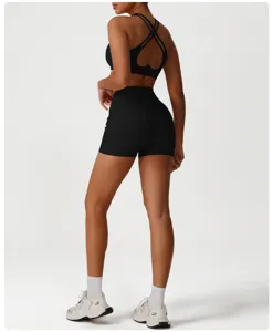 Detailed view of women's high-waisted athletic shorts and sports bra set for fitness.