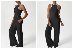 Detailansicht von schwarzem Sporttop und weiten Hosen mit komfortablen Stoffdetails.