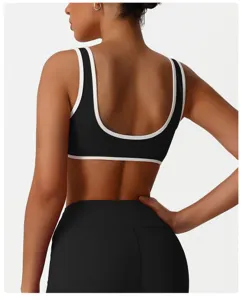 Soutien-gorge de sport noir pour femme, haut de fitness dos U avec bord blanc, idéal pour le yoga.